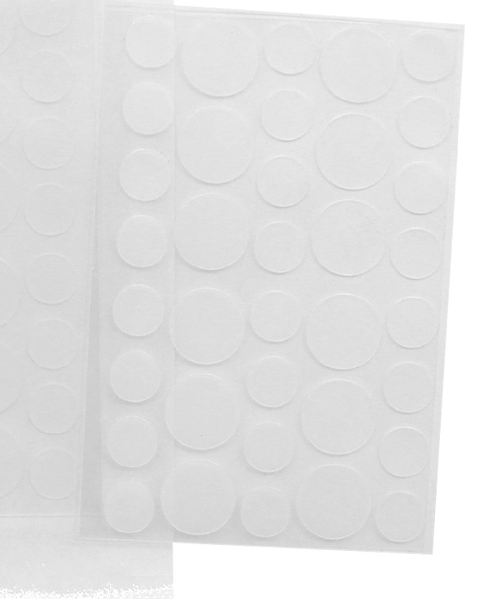 Close-up of a sheet of clear round hydrocolloid patches in two sizes